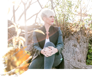 woman sitting on tree relecting