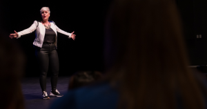 Amber speaking on stage